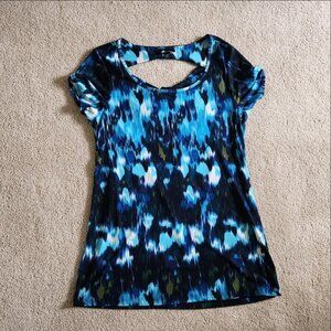 Patterned blue and teal blouse with open back